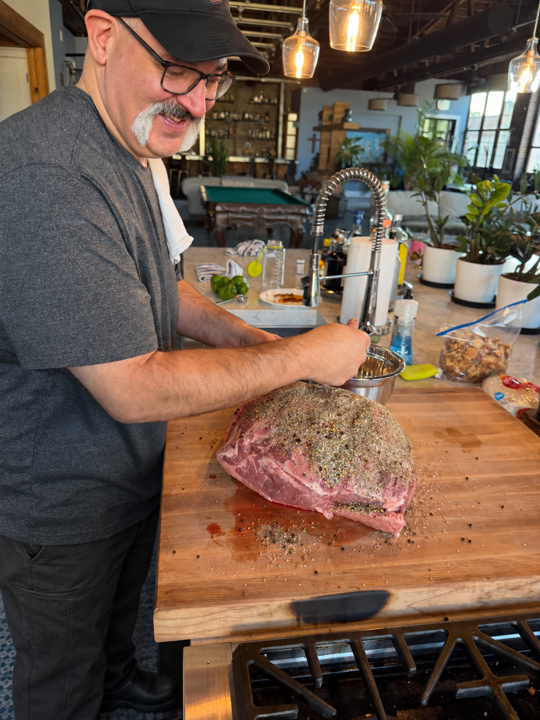 Doug seasoning the bottom round roast.